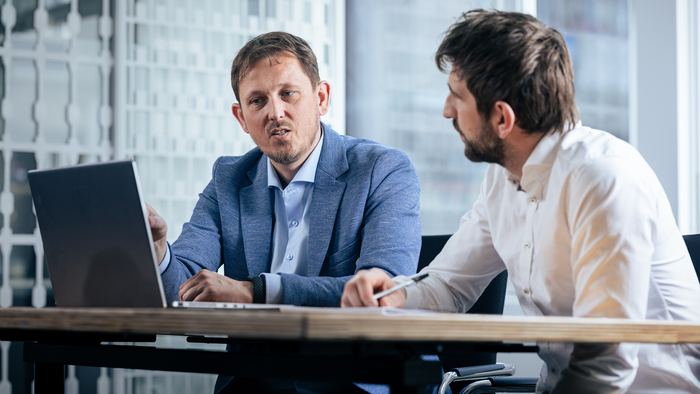 Frank van Delden working through a report with a client